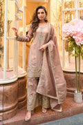 Woman in traditional beige outfit with floral decorations in a decorative setting