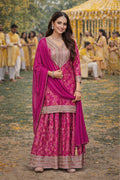 Woman in a pink traditional outfit with a yellow background