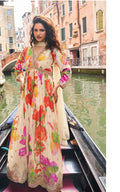 Woman in a colorful dress on a gondola in Venice