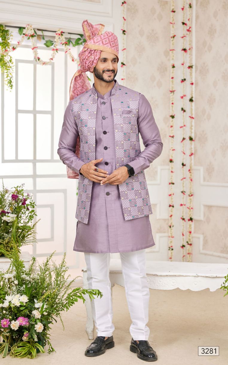 Man wearing a traditional lavender sherwani with a matching turban in a decorated room.